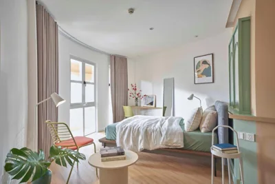Camera Doppia Deluxe con balcone — Express by M Village Phạm Ngũ Lão, a brand of Modern Village Lifestyle